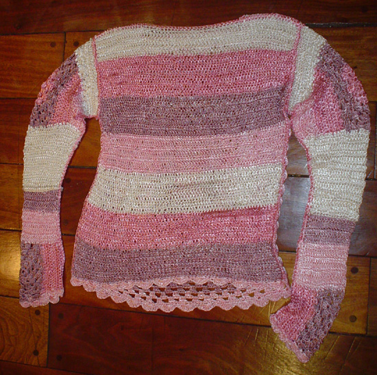 Sueter tejido artesanalmente en tonos rosados
